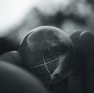 hand keeping a glass globe
